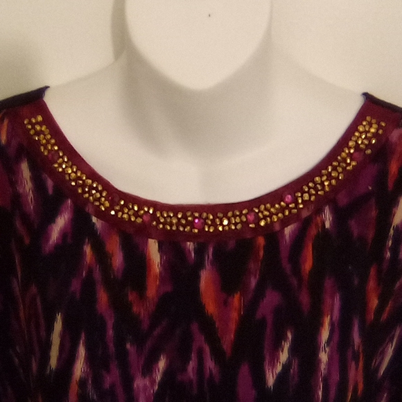 Asymmetrical Top With Accent Beads and Shark Bite Hem - Picture 9 of 10